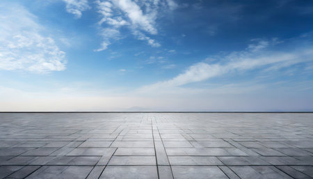 Empty square floor and blue sky with white clouds. Perspective view.の素材
