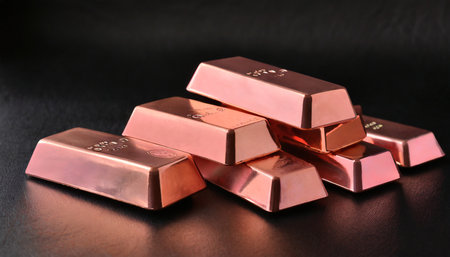 A pile of gold bars on a black background, close-upの素材