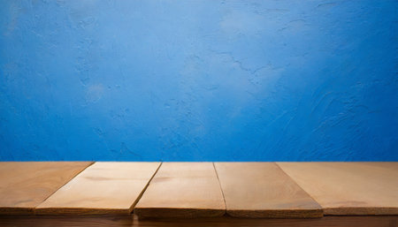 Empty wooden table and blue wall background, for product display montageの素材