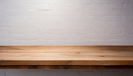 Empty wooden table top on white brick wall background. For product displayの素材