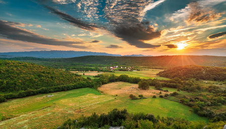 Sunset over the village in the mountains. Ukraine, Europe.の素材