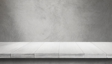 Empty white wooden table over concrete wall background, product display montageの素材