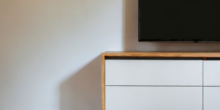 TV on the white cabinet in modern living room with copy space.の素材