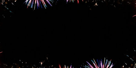 Colorful fireworks on the black sky background with copy space for textの素材
