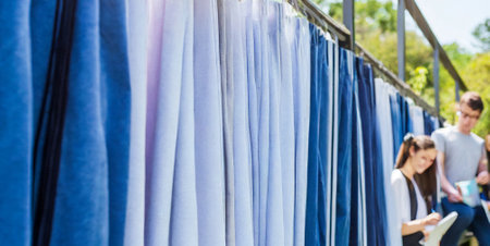 Close-up of clothes hanging on a clothesline in the gardenの素材