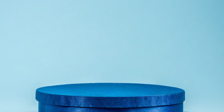 Blue round podium on a blue background. Place for your text.の素材