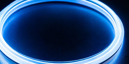 Blue LED light on black background, close up. Abstract background.の素材
