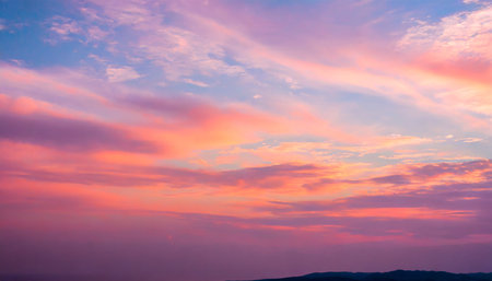Sunset sky with colorful clouds. Colorful sunset sky background.の素材