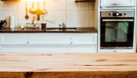 Empty wooden table and blurred kitchen interior background, product display montageの素材