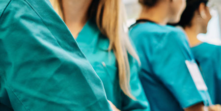 Group of surgeons at work in operating theater toned in green.の素材