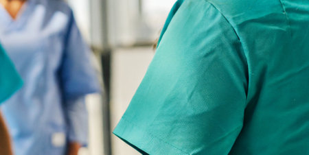 Close-up of a doctor and nurse standing in a hospital corridorの素材