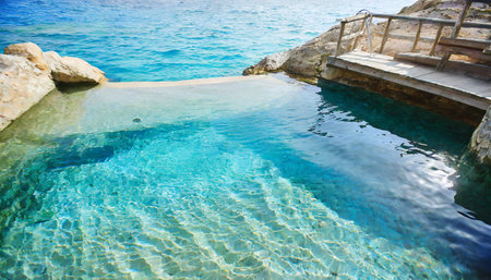 blue ripped sea water as swimming pool crystal clear ocean lagoon bay turquoise blue azure water surface closeup natural environment tropical mediterranean beach water backgroundの素材