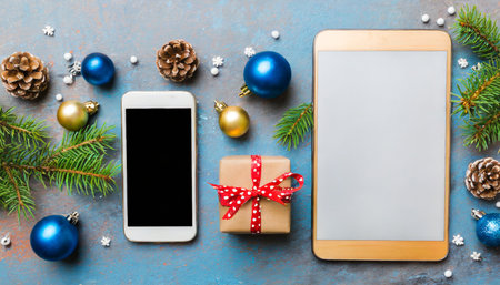 digital phone mock up with rustic christmas decorations for app presentation top view with empty space for you design christmas online shopping concept tablet with copy space on colored backgroundの素材