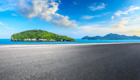 asphalt road and sea with island natural landscape in summerの素材