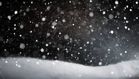 falling snow isolated on black backgroundの素材