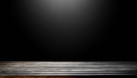 Empty wooden table in front of black background. Ready for product display montageの素材