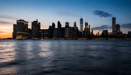 New York City Manhattan skyline panorama over Hudson River at sunset.の素材