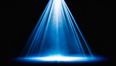 blue spotlight light beam on black backgroundの素材