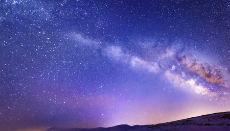 night starry sky and bright purple blue galaxy horizontal background bannerの素材