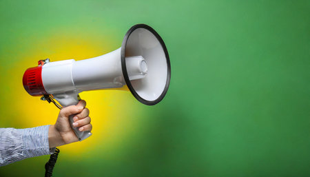holding megaphone on color backgroundの素材