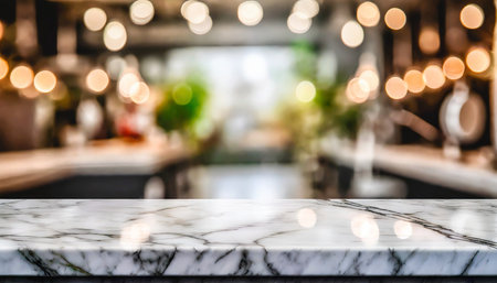 empty white table top counter desk background over blur perspective bokeh light background white marble stone table shelf and blurred kitchen restaurant for food product display mockup templateの素材