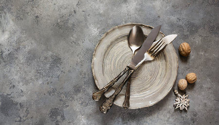 plate and serving of cutlery on a gray background grunge style generative aiの素材