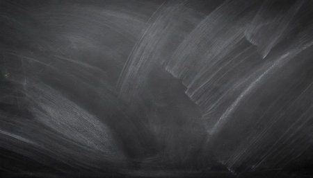 abstract texture of chalk rubbed out on blackboard or chalkboard background school education dark wall backdrop or learning conceptの素材