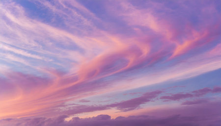 pink purple violet cloudy sky beautiful soft gentle sunrise sunset with cirrus clouds background textureの素材