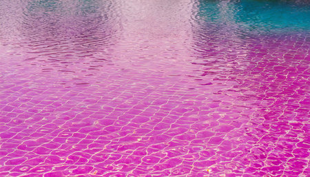 beautiful pink water in swimming pool texture backgroundの素材