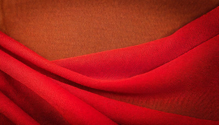 closeup of red fabric textile material as texture or backgroundの素材