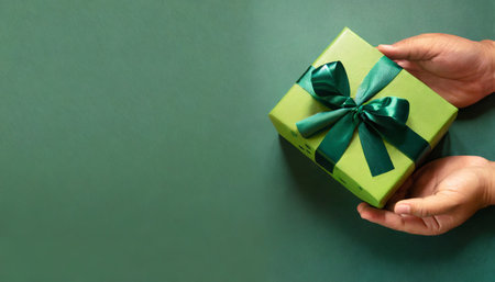 banner with green gift box with ribbon and bow for man and boy on green background holiday gift with birthday or christmas present flat lay top view father s day copy space generated by aiの素材