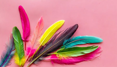 design for blog or desktop with colorful bird feathers on pink background top view mockupの素材