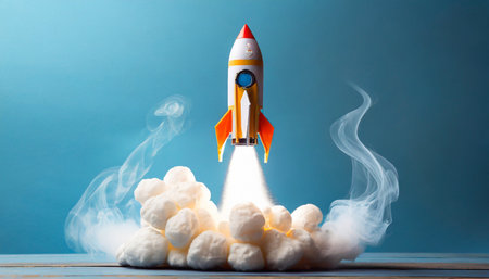 toy rocket takes spewing smoke on a blue background the symbol for success is startup education and knowledge generative aiの素材