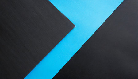 black paper and light blue paper crossing for background colorの素材