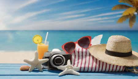 beach accessories on blue plank summer holiday bannerの素材