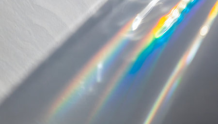 water texture overlay effect for photo and mockups organic drop diagonal shadow caustic effect with rainbow refraction of light on a white wallの素材