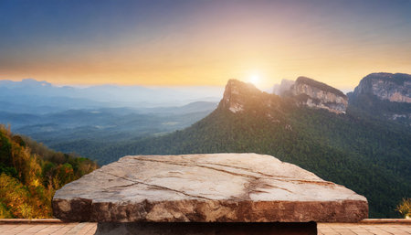 outdoor rock table top with mountain landscape at sunrise showcasing organic beautyの素材
