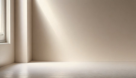 minimalistic abstract light pearl color background for product presentation incident light from the window on the wall and floorの素材