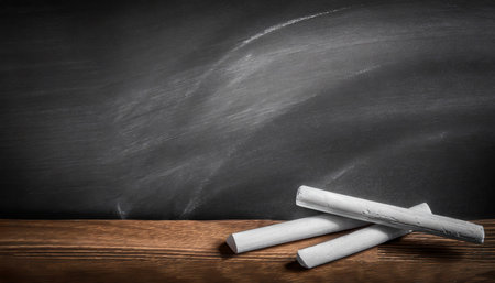 texture of chalk on blackboard or chalkboard background can be use as concept for school education dark wall backdrop design templateの素材