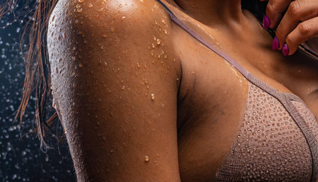 drops of sweat on tanned skin close upの素材