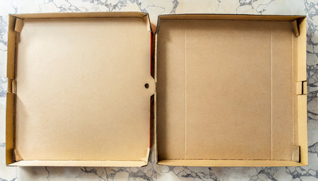 pizza box with leftowers empty pizza cardboard box viewed from above top viewの素材