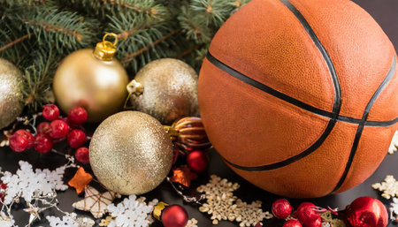 sporty holiday cheer festive basketball christmas card with ball and decorative ornamentsの素材