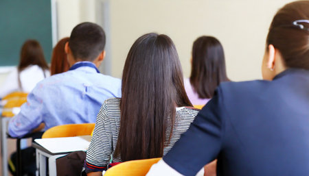 students sitting in classroomの素材