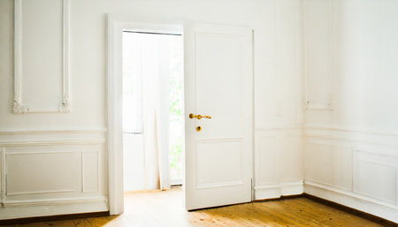 open white door in empty room