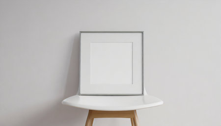 square frame with poster mockup standing on the white chair 3d renderingの素材