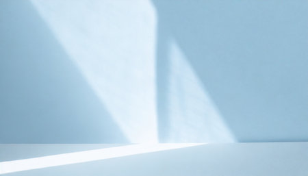 light minimalist geometric background image in gray and light blue tones with light and shadow from window for product presentationの素材
