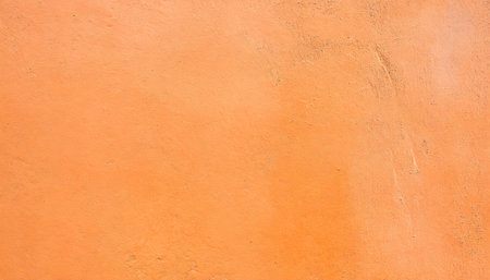 orange color textured concrete wall with space for textの素材