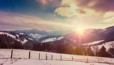 winter mountain landscape colorful overcast sky with lens flare bokehの素材