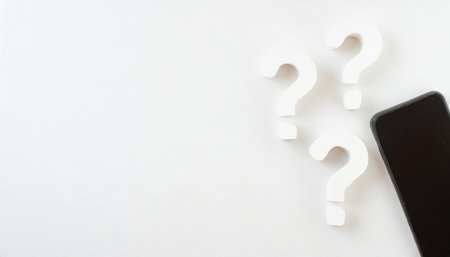 three white question marks symbol on white floor flat lay top view from above with copy space question faq or brainstorming conceptの素材