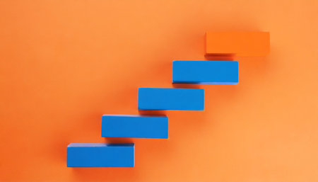 blue stairs leading to orange top step success top level or career minimal modern conceptの素材